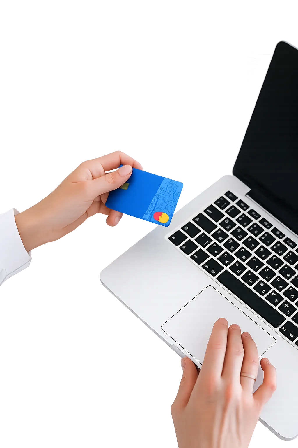 Hand holding a payment card beside a laptop